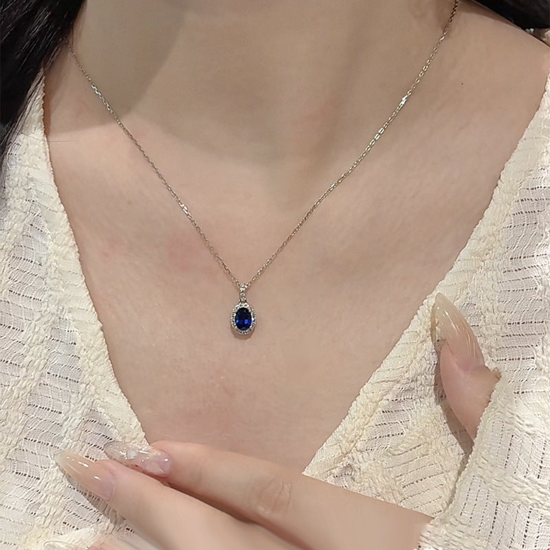 The Isolde Royal Blue Oval Halo Pendant Necklace