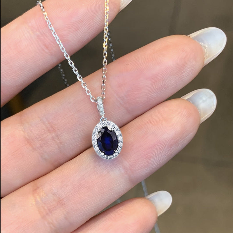 The Isolde Royal Blue Oval Halo Pendant Necklace