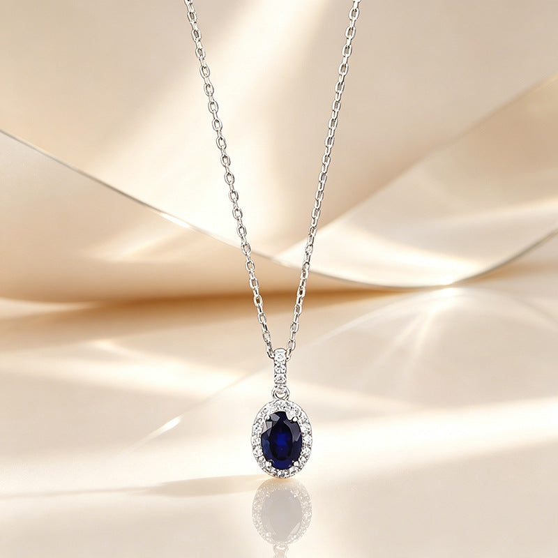 The Isolde Royal Blue Oval Halo Pendant Necklace