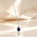 The Isolde Royal Blue Oval Halo Pendant Necklace