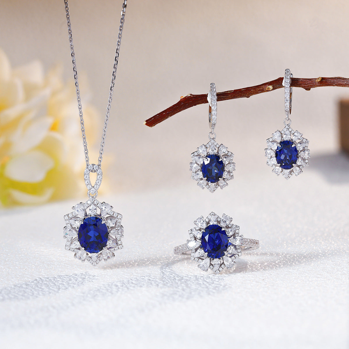 The Isadora Blue Sapphire Halo Jewelry Suite