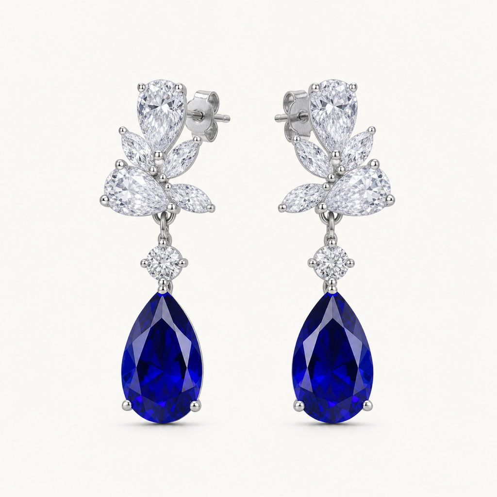 Celestine blue sapphire pear drop earrings on warm white