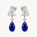 Celestine blue sapphire pear drop earrings on warm white