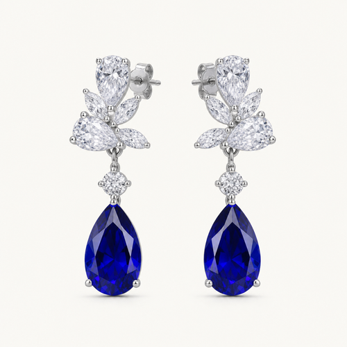 Celestine blue sapphire pear drop earrings on warm white