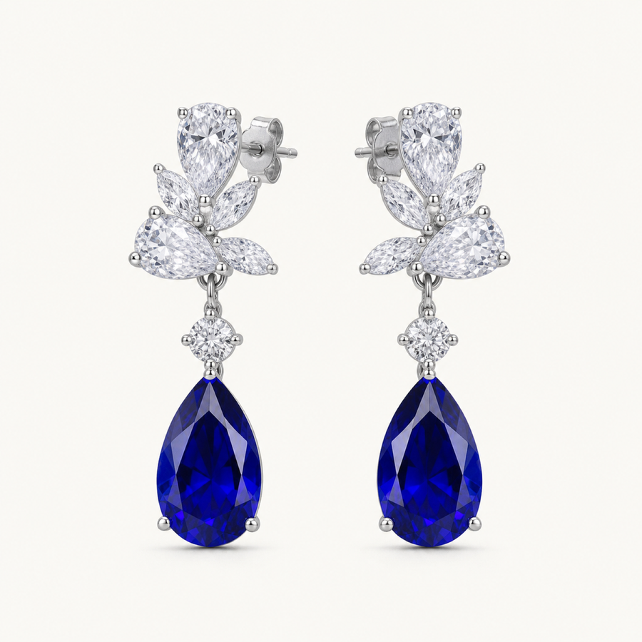 Celestine blue sapphire pear drop earrings on warm white