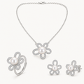 Colette pearl flower jewelry suite on warm white