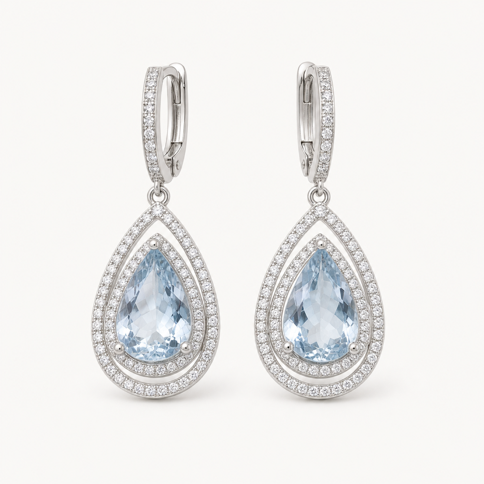 Delphine natural aquamarine drop earrings on warm white