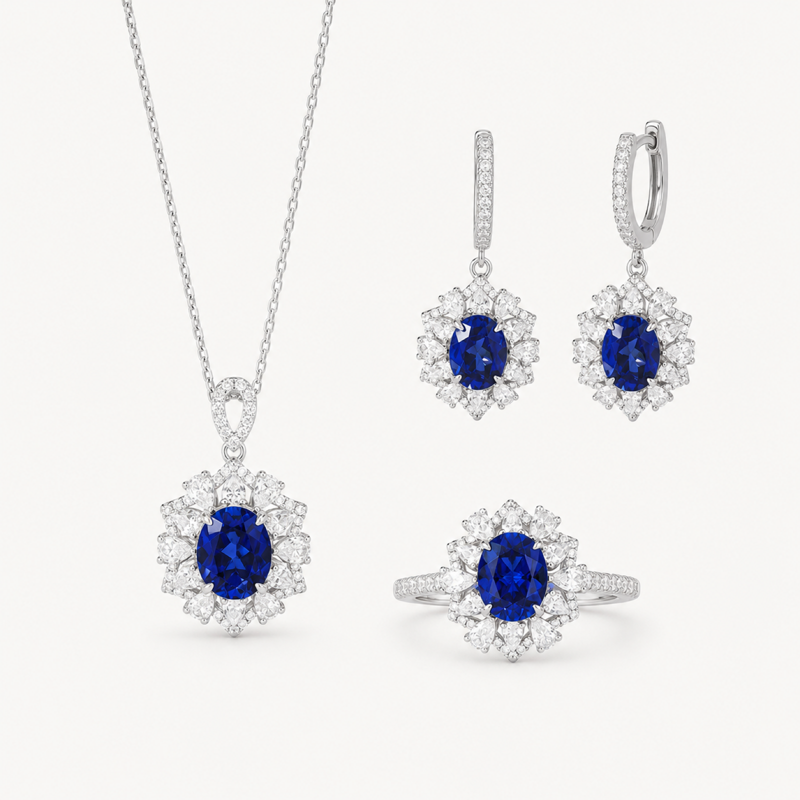 Isadora blue sapphire halo jewelry suite on warm white