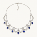 The Royale Natural Blue Sapphire Pendant Necklace on warm white