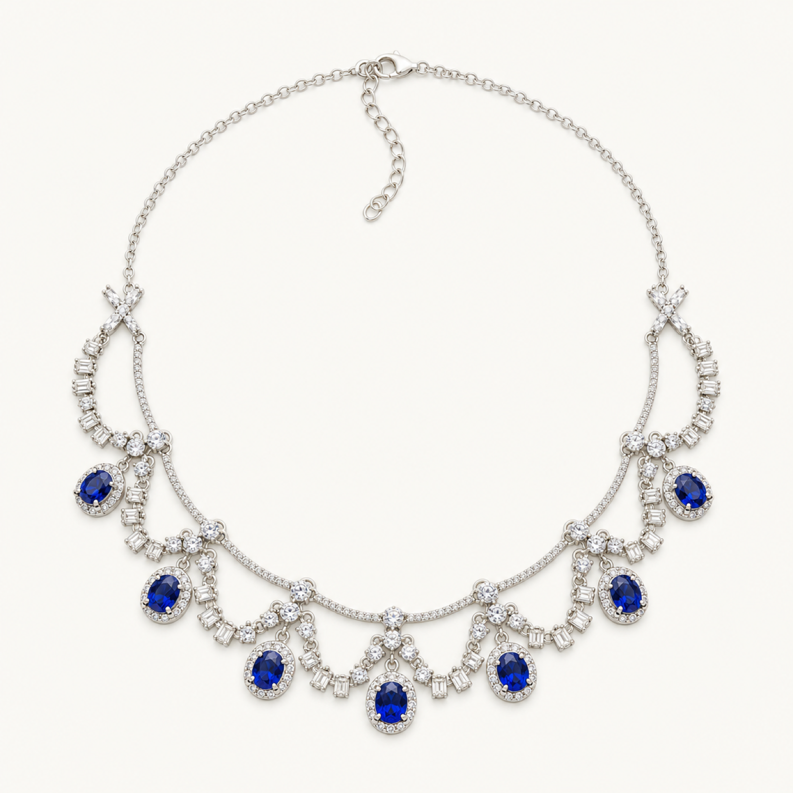 The Royale Natural Blue Sapphire Pendant Necklace on warm white