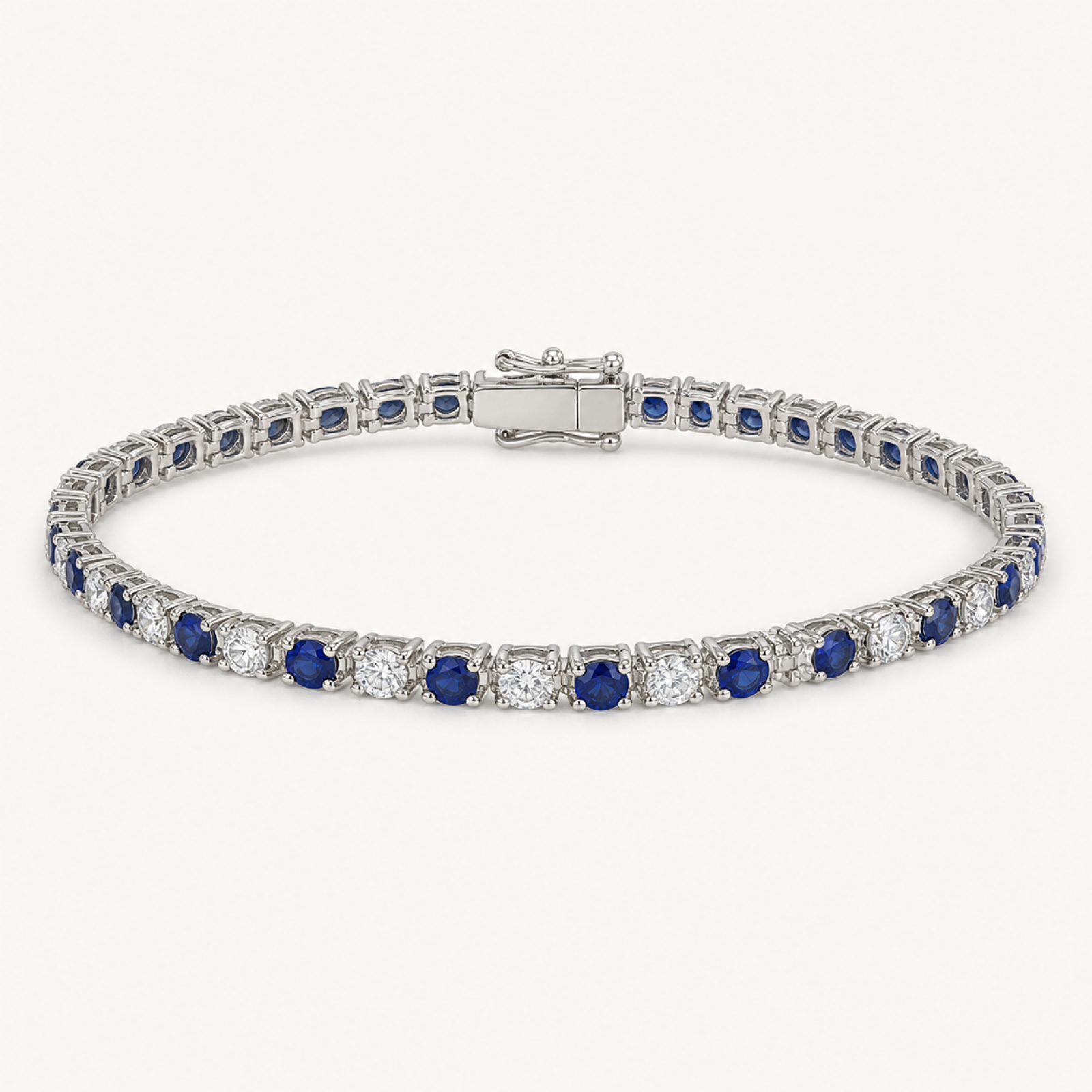 The Sabine Blue Sapphire Tennis Bracelet on warm white