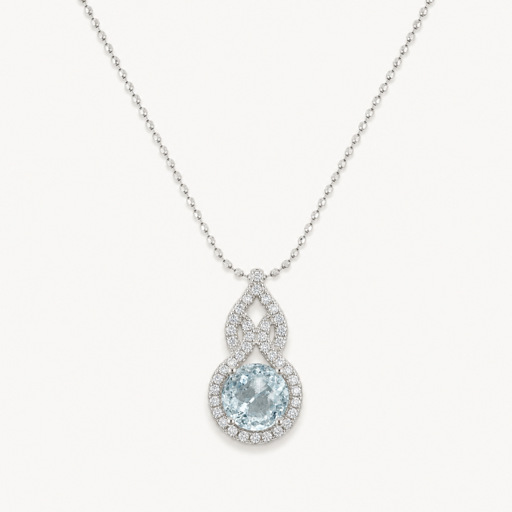 The Serena Natural Aquamarine Cushion Pendant on warm white