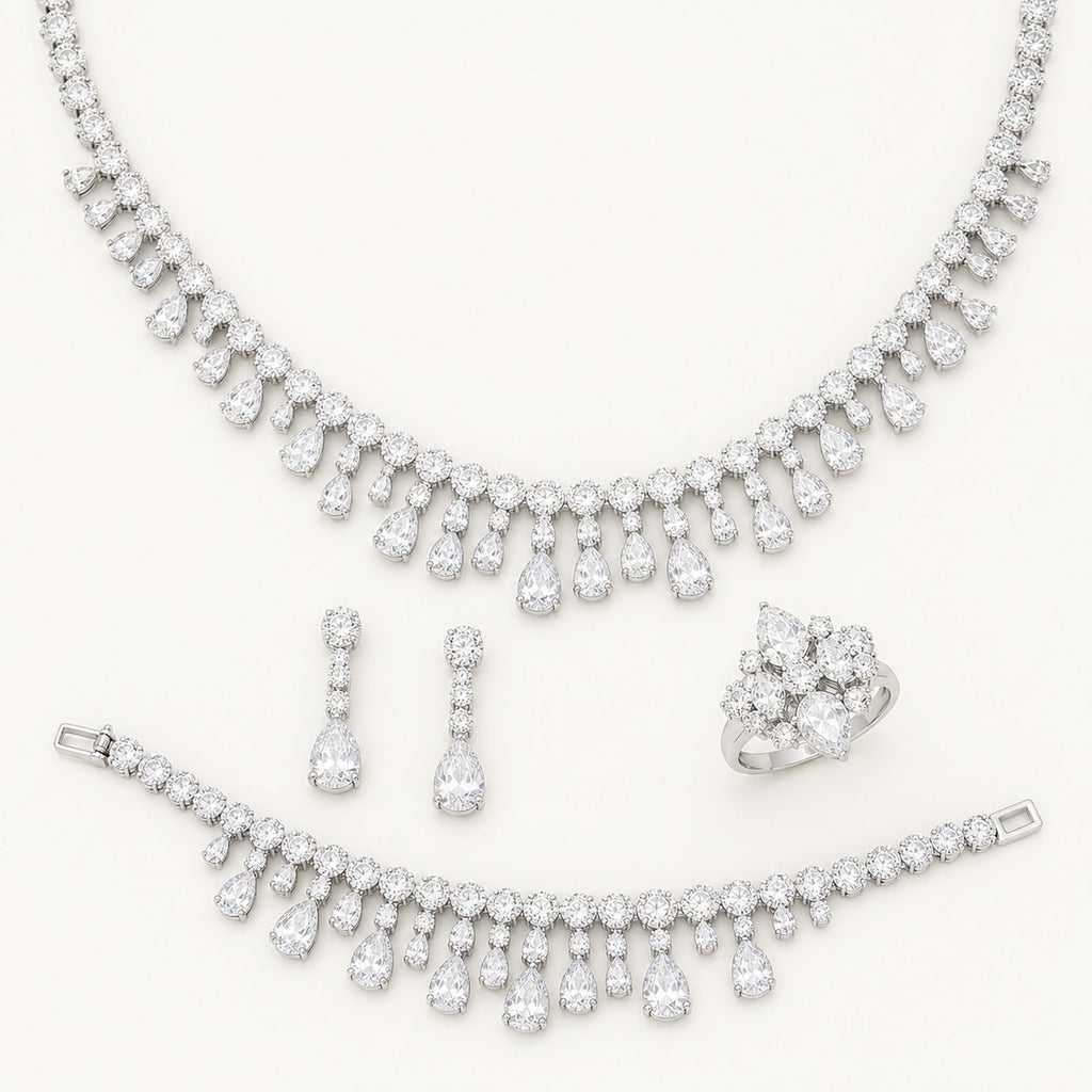 The Amelie Teardrop Fringe Jewelry Set on a warm white background