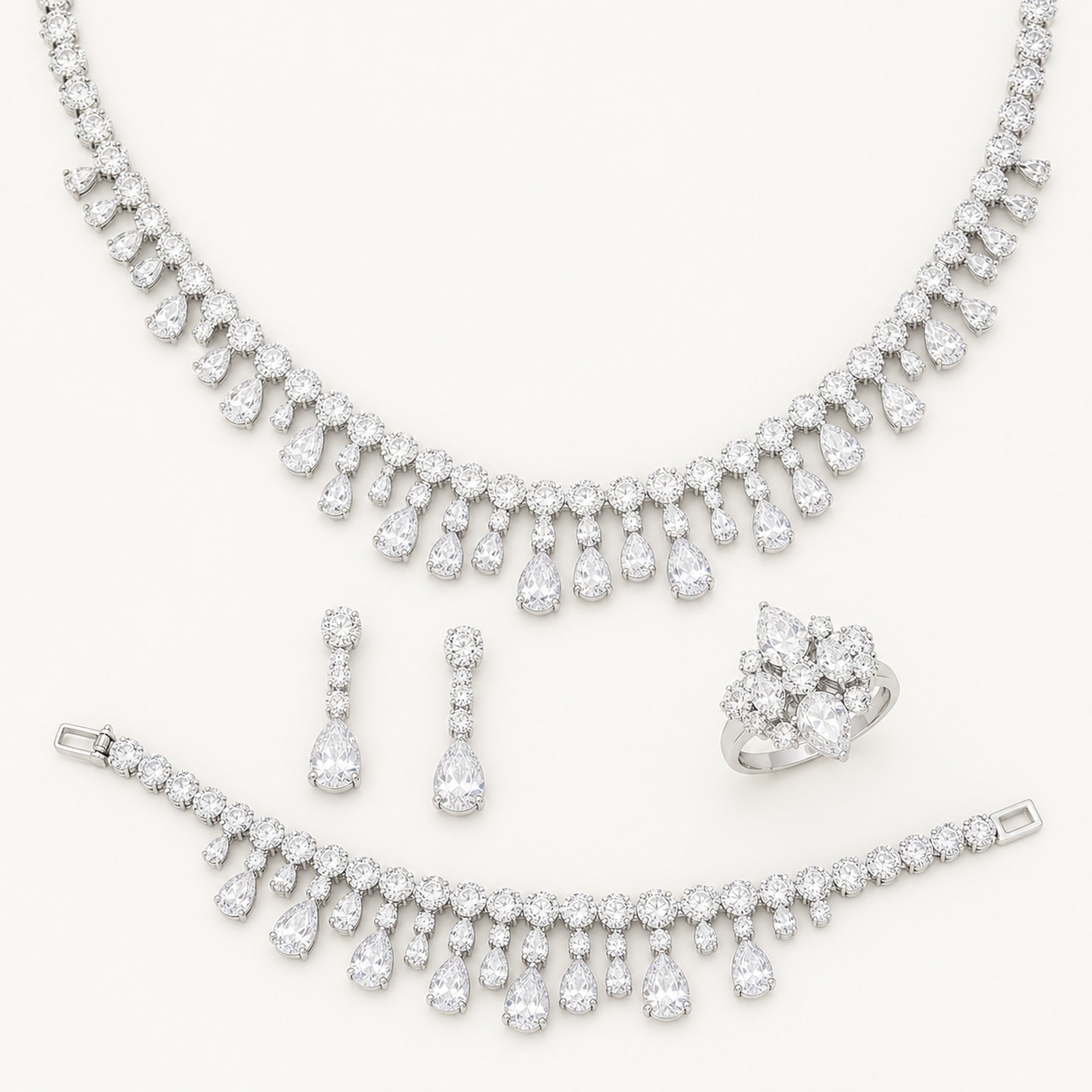 The Amelie Teardrop Fringe Jewelry Set on a warm white background