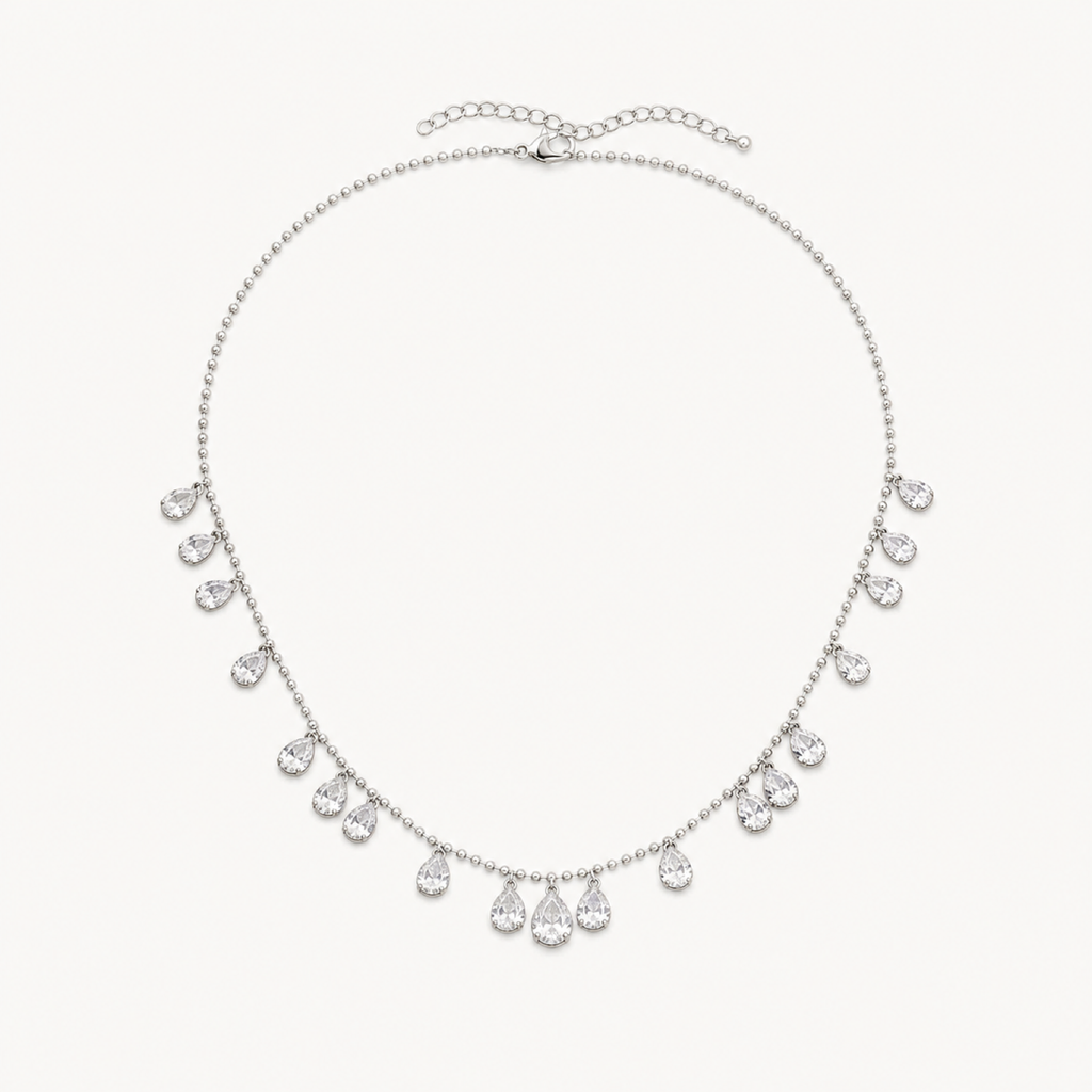 Astra celestial pear drop necklace on warm white
