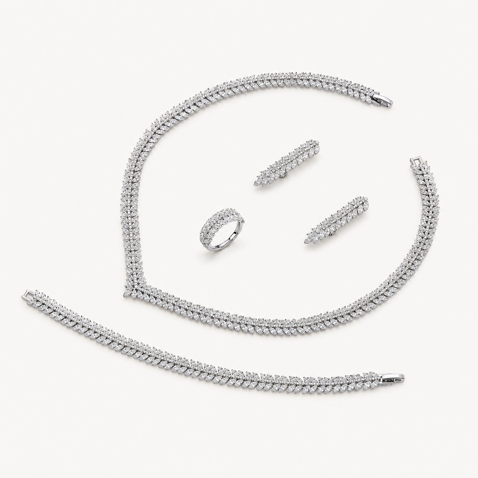 The Camille Classic Crystal Bridal Jewelry Set on a warm white background