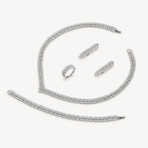 The Camille Classic Crystal Bridal Jewelry Set on a warm white background