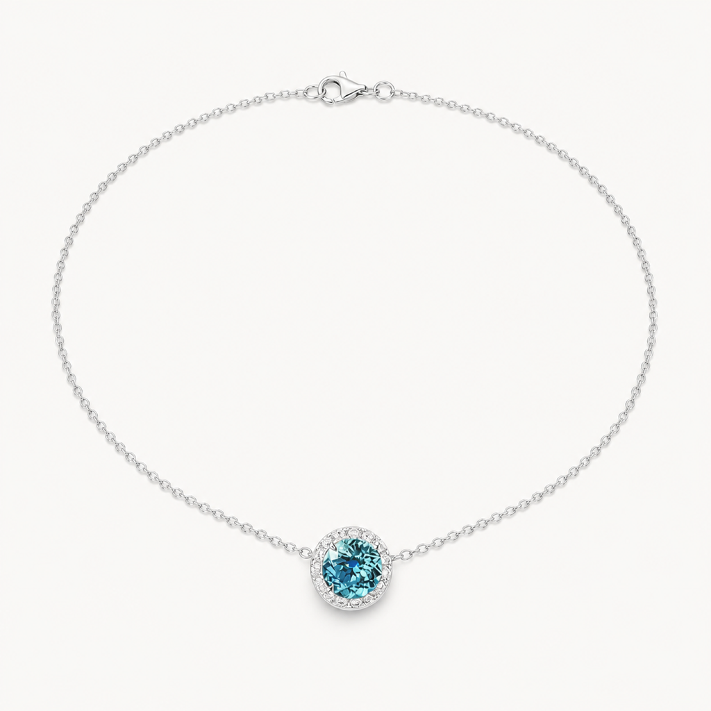 Celine Paraiba blue solitaire necklace on warm white