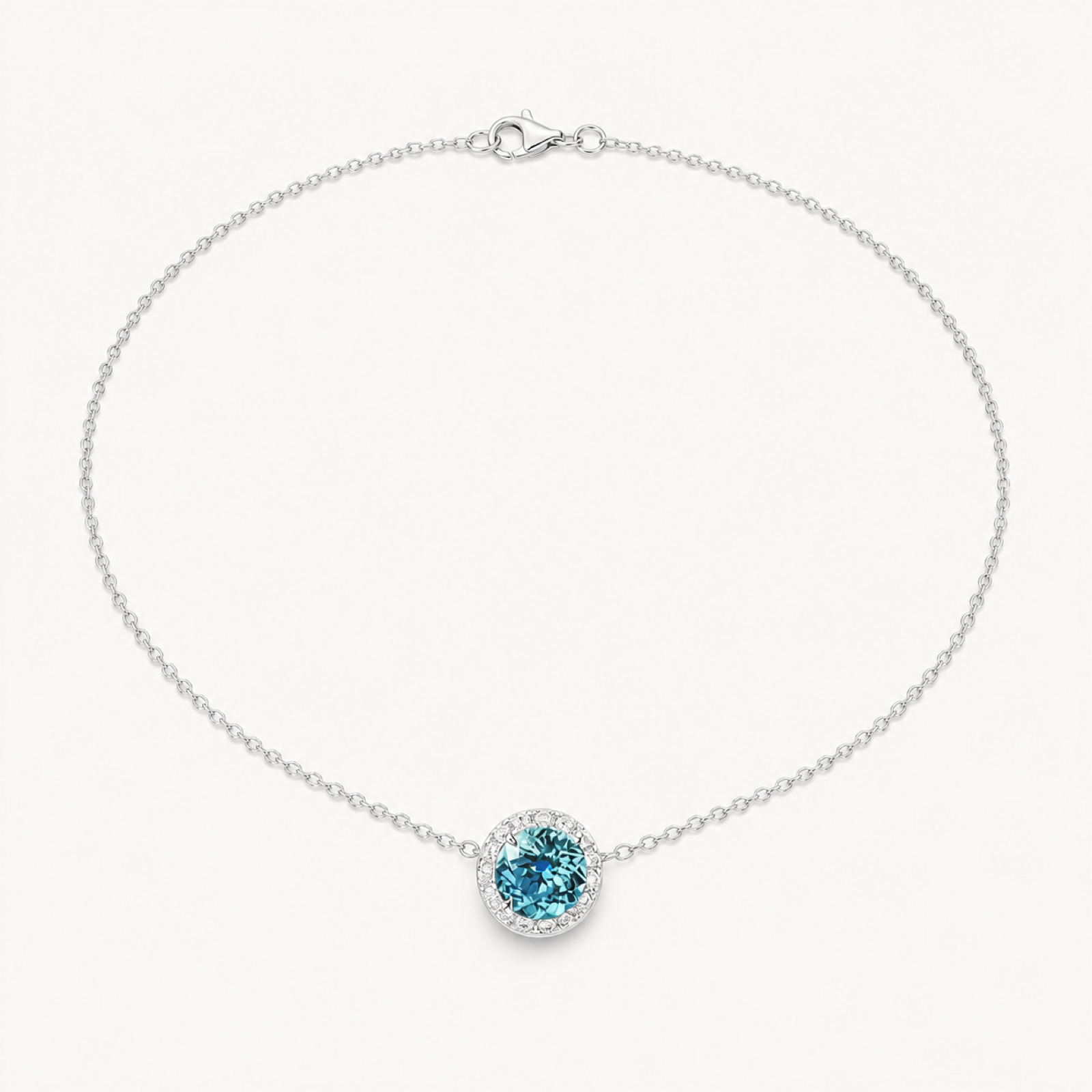 Celine Paraiba blue solitaire necklace on warm white