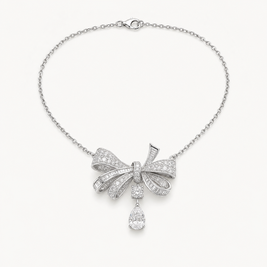 Colette bow drop necklace on warm white