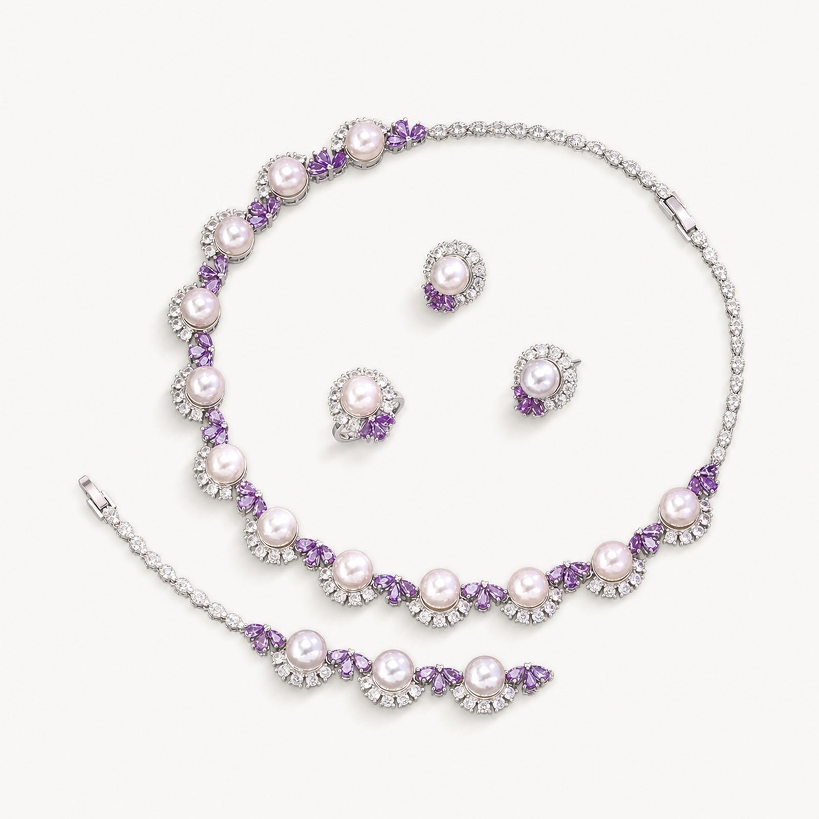 The Colette Pearl Flower Jewelry Set on a warm white background