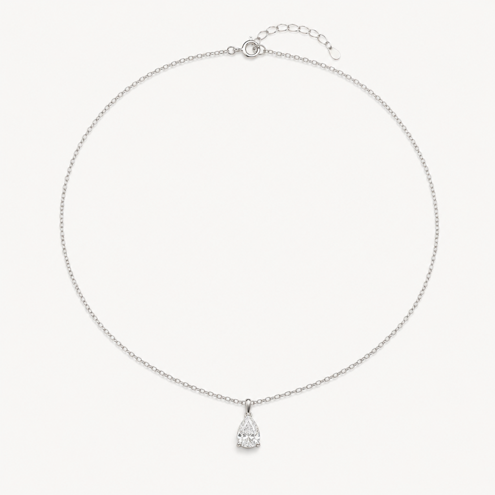 Delphine pear drop pendant necklace on warm white
