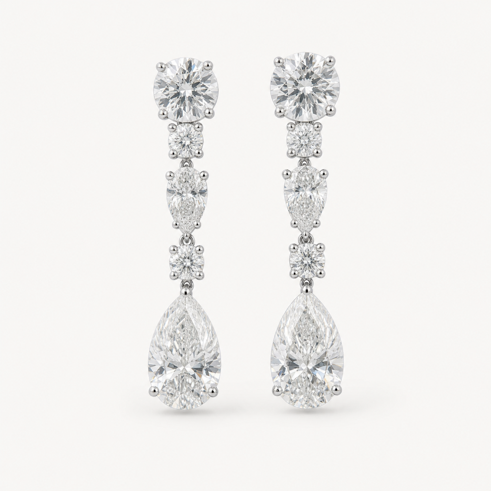 Estelle long pear drop evening earrings on warm white