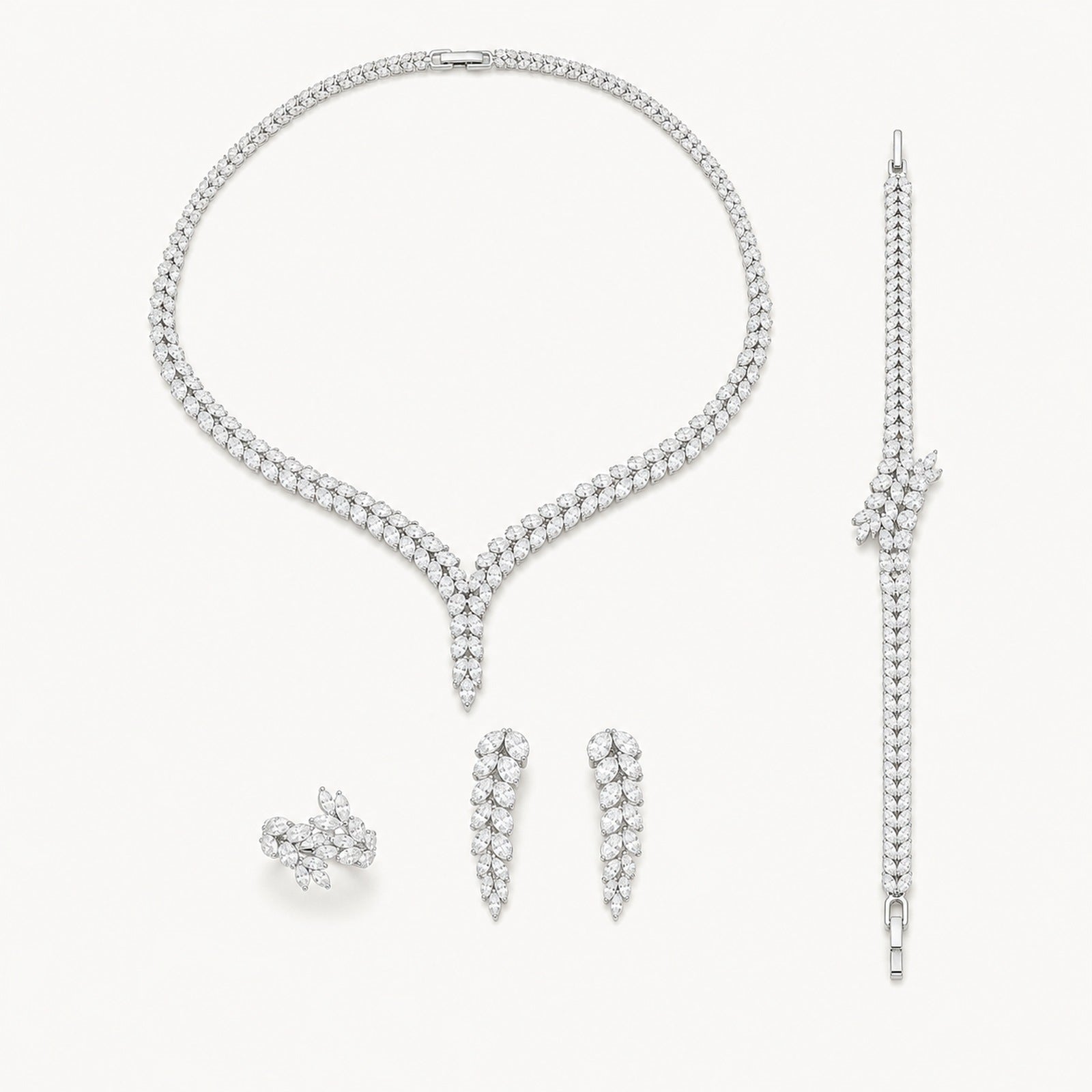 The Genevieve Y-Drop Bridal Jewelry Set on a warm white background