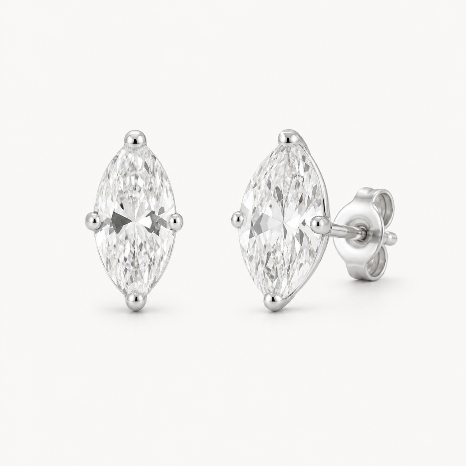 Iris marquise mini stud earrings on warm white