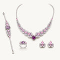 The Juliette Pink Marquise Bridal Jewelry Set on a warm white background