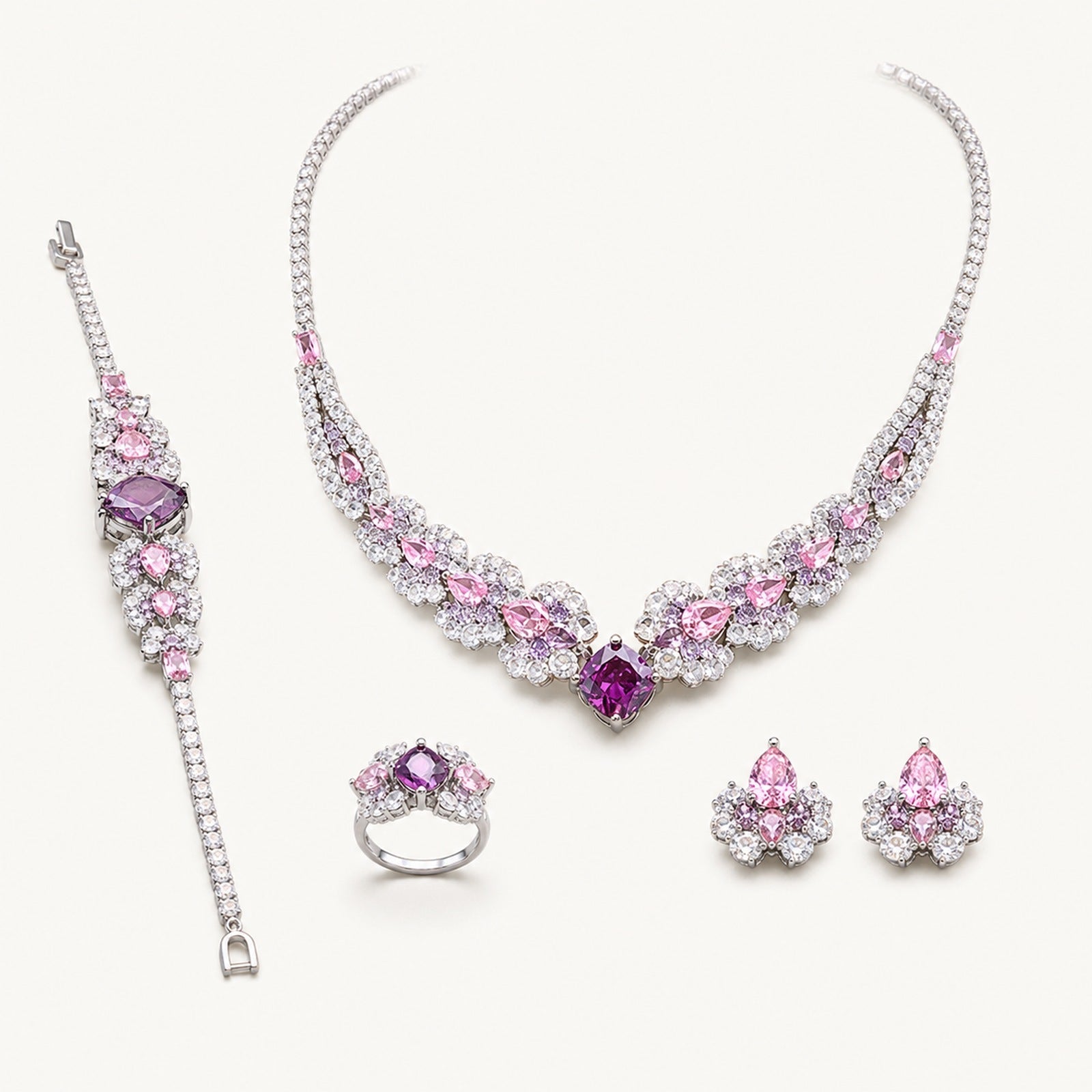 The Juliette Pink Marquise Bridal Jewelry Set on a warm white background