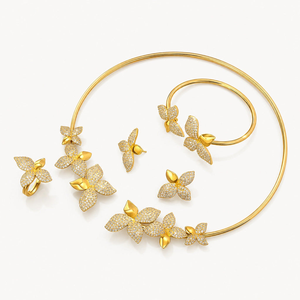 The Mariposa Gold Butterfly Jewelry Set on a warm white background