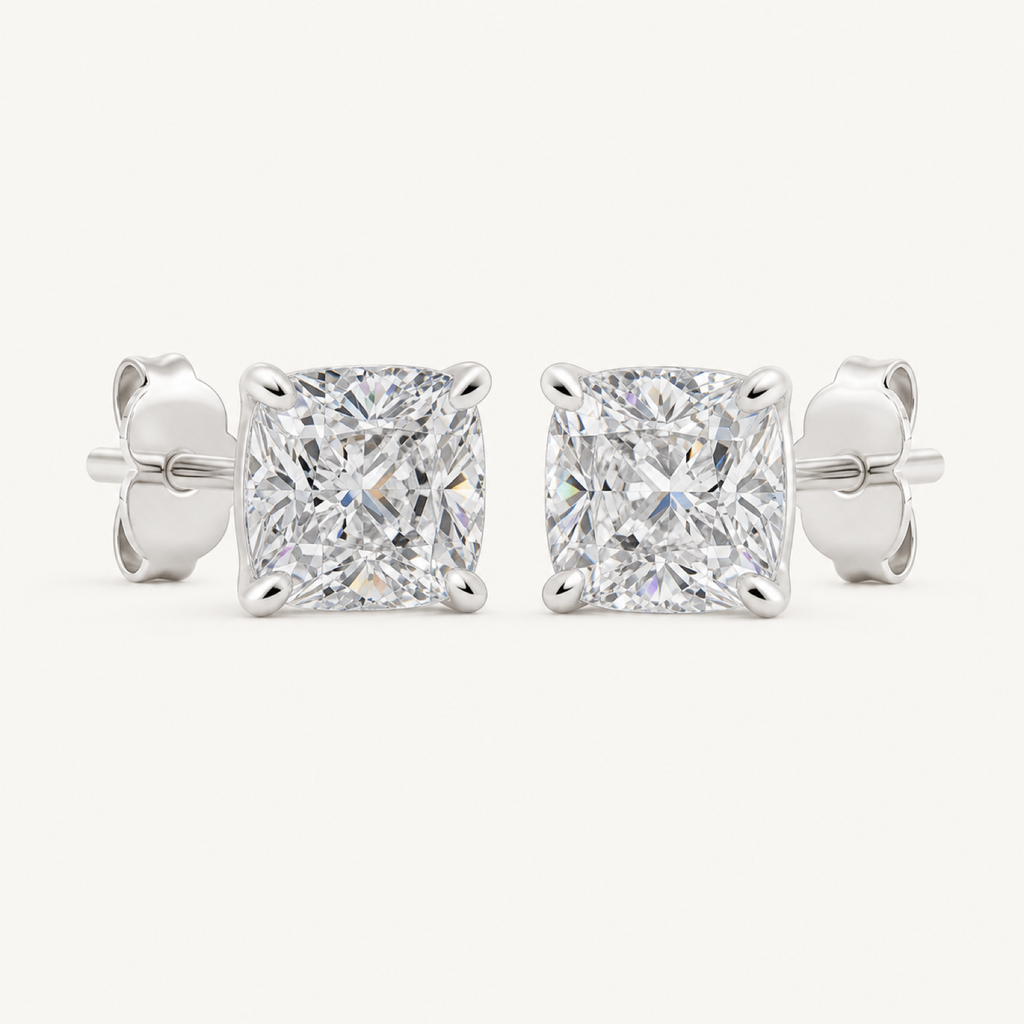 The Odette Cushion-Cut Crystal Stud Earrings on warm white
