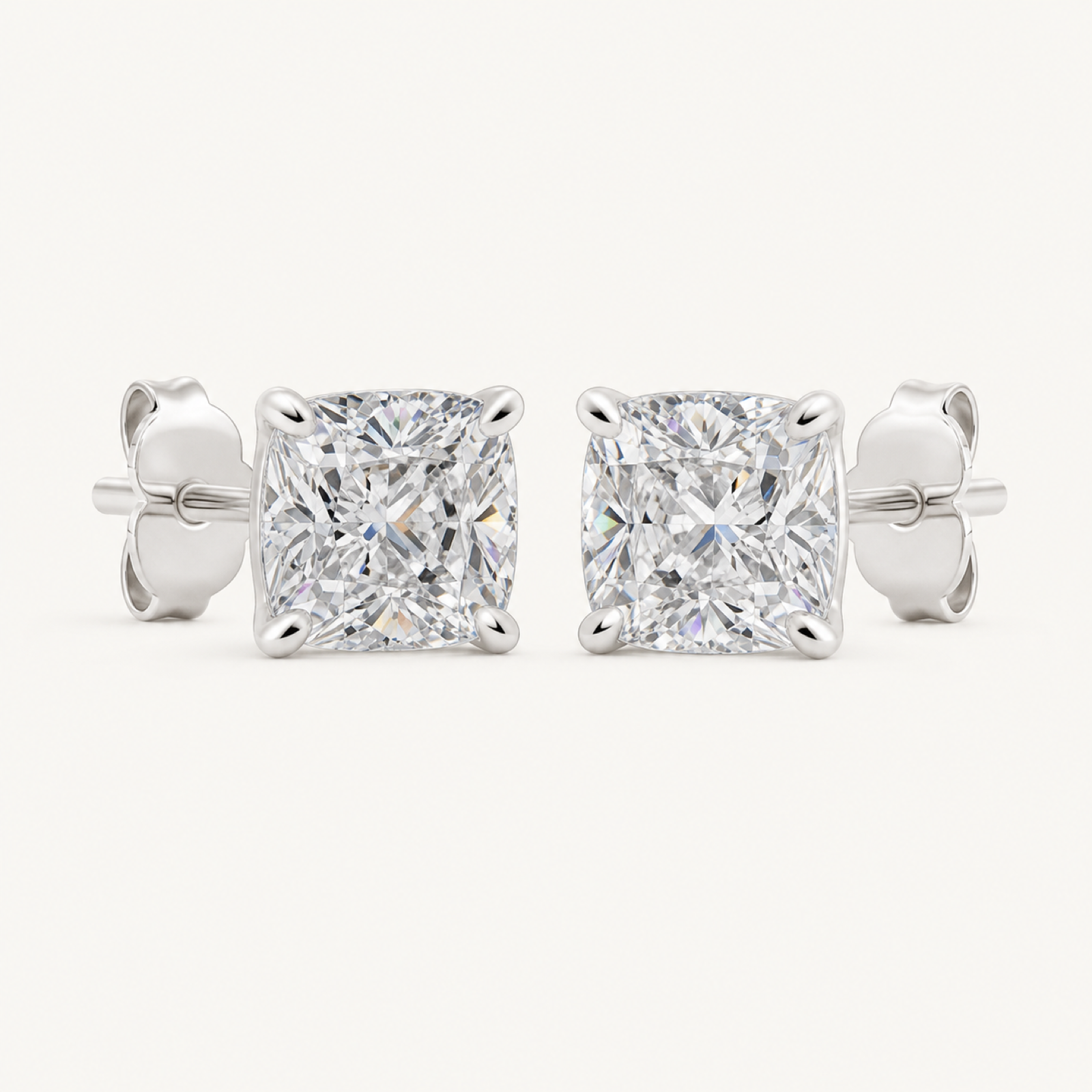 The Odette Cushion-Cut Crystal Stud Earrings on warm white