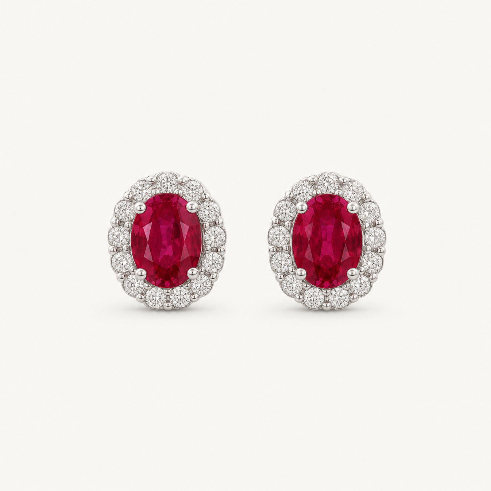 The Rosalie Ruby-Red Oval Stud Earrings on warm white