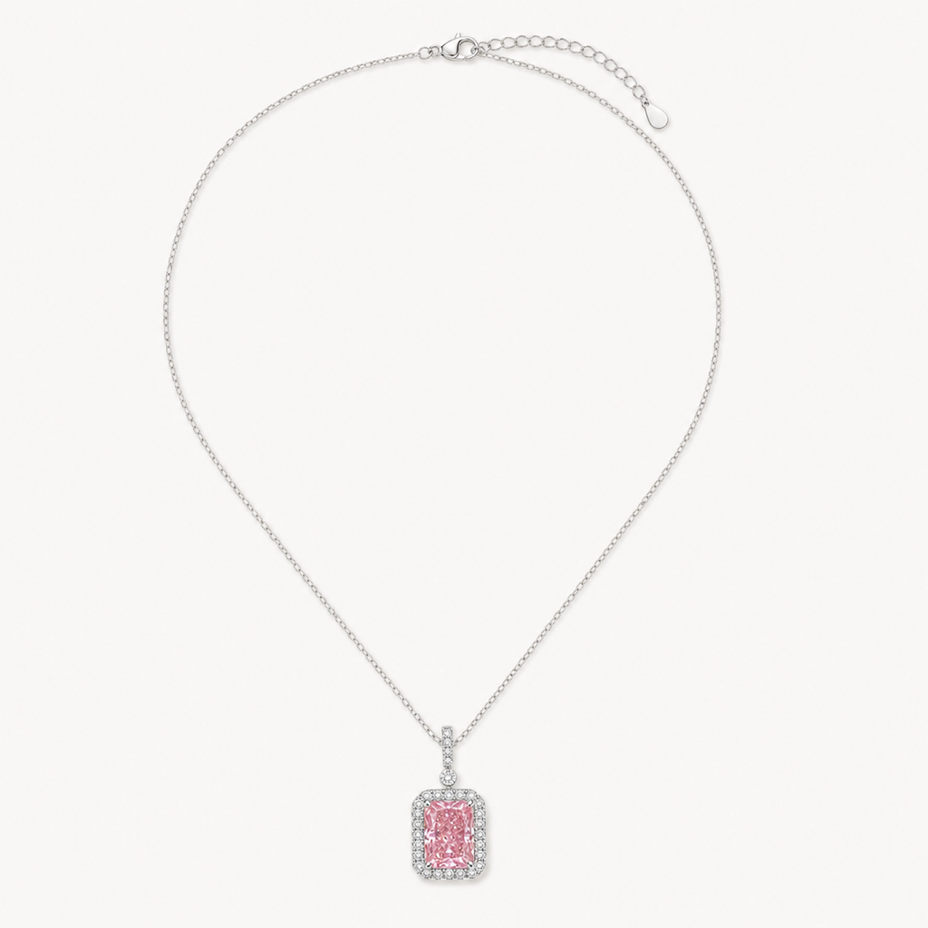 The Sabine Padparadscha Ice-Cut Pendant Necklace on warm white