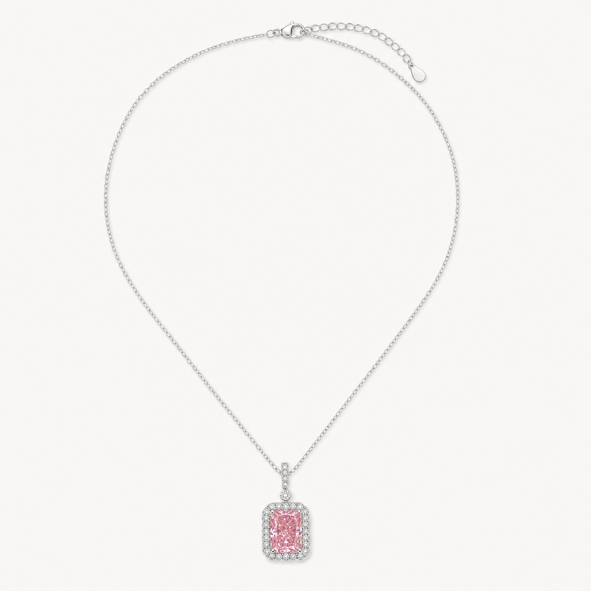 The Sabine Padparadscha Ice-Cut Pendant Necklace on warm white