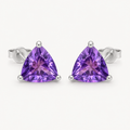 The Violette Natural Amethyst Round Stud Earrings on warm white