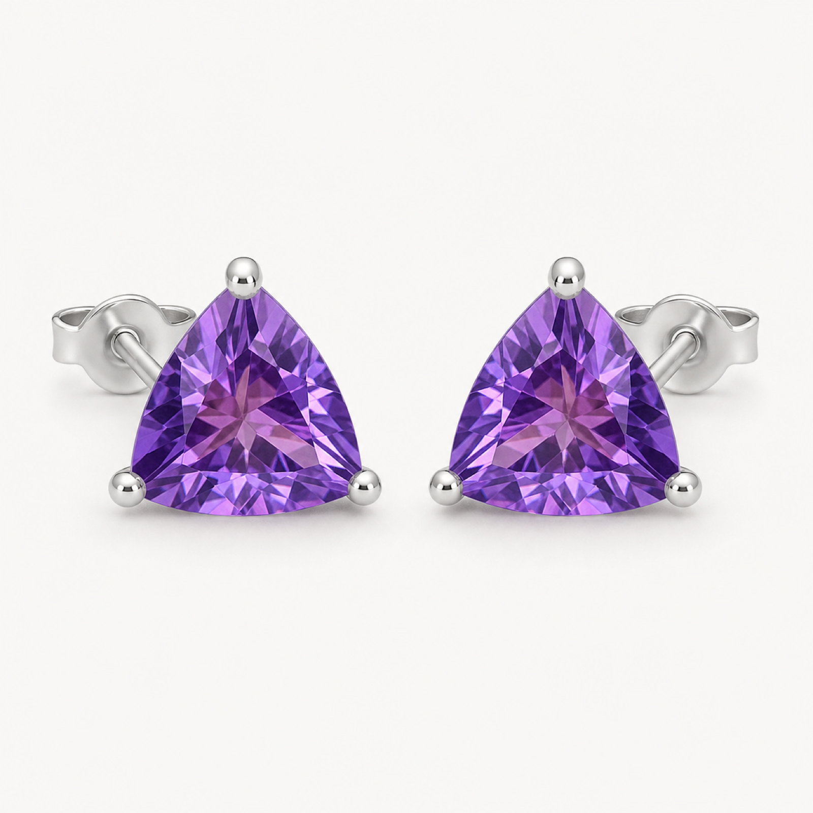 The Violette Natural Amethyst Round Stud Earrings on warm white
